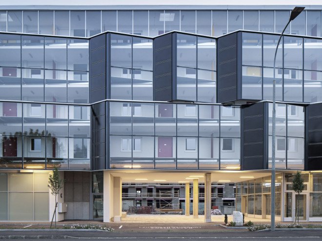 Glanhof housing, glass facade, multifamily housing, social housing, Austria, Architects Collective, solar design, solar panels, heat pump, geothermal, solar power, green architecture