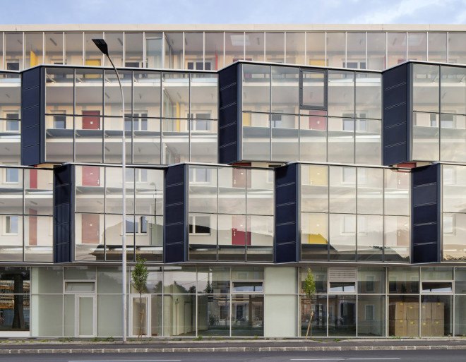 Glanhof housing, glass facade, multifamily housing, social housing, Austria, Architects Collective, solar design, solar panels, heat pump, geothermal, solar power, green architecture