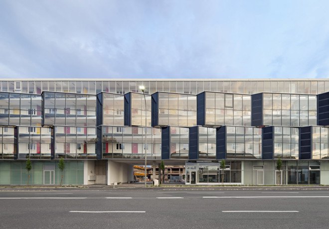 Glanhof housing, glass facade, multifamily housing, social housing, Austria, Architects Collective, solar design, solar panels, heat pump, geothermal, solar power, green architecture