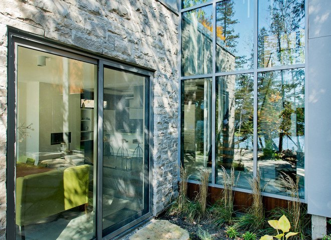 Boom Town, Eric Joseph Tremblay, Canada, chalet, wooden cladding, cedar cladding, stone, natural materials, floor-to-ceiling windows, Canada, natural light, daylit spaces, mountain retreat