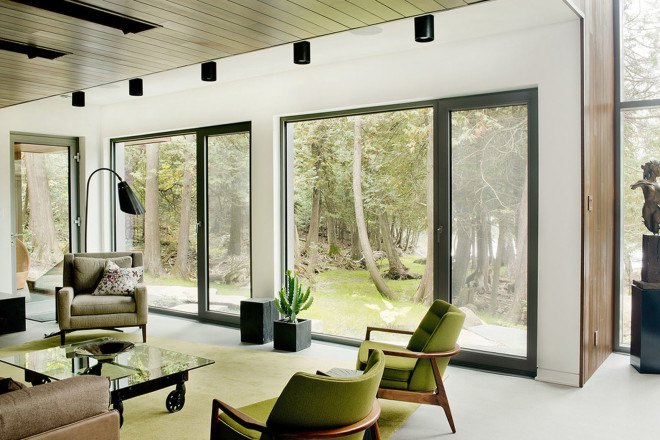 Boom Town, Eric Joseph Tremblay, Canada, chalet, wooden cladding, cedar cladding, stone, natural materials, floor-to-ceiling windows, Canada, natural light, daylit spaces, mountain retreat