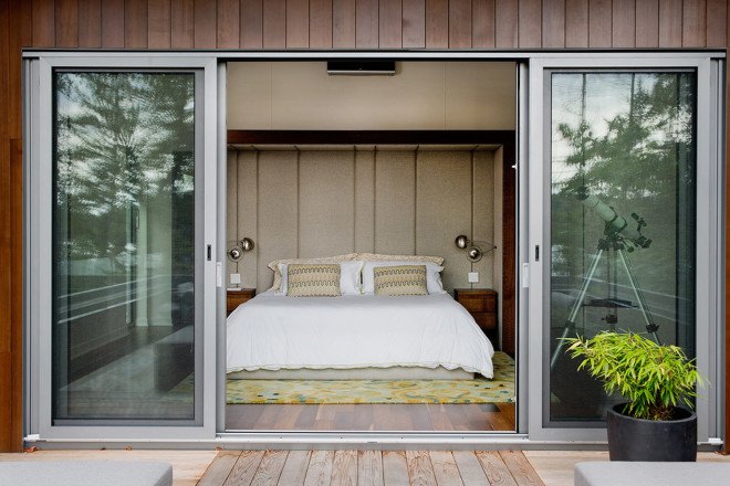 Boom Town, Eric Joseph Tremblay, Canada, chalet, wooden cladding, cedar cladding, stone, natural materials, floor-to-ceiling windows, Canada, natural light, daylit spaces, mountain retreat