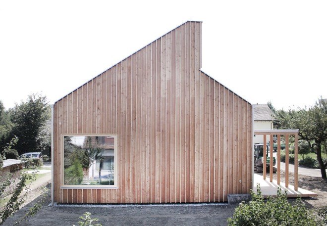 prefab housing, Tom Munz Architekt, House at Lake Constance by Tom Munz Architekt, Lake Constance, wooden home, timber home, prefab timber home, French Aleppo pine, open plan layout, larch, sustainably sourced wood, Egnach