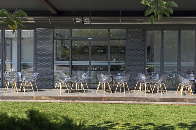 D Cafe, Dogus Automotive AS, Turkey, green interiors, recycled metal, metal facade, perforated facade, green architecture, natural lighting, floor-to-ceiling window