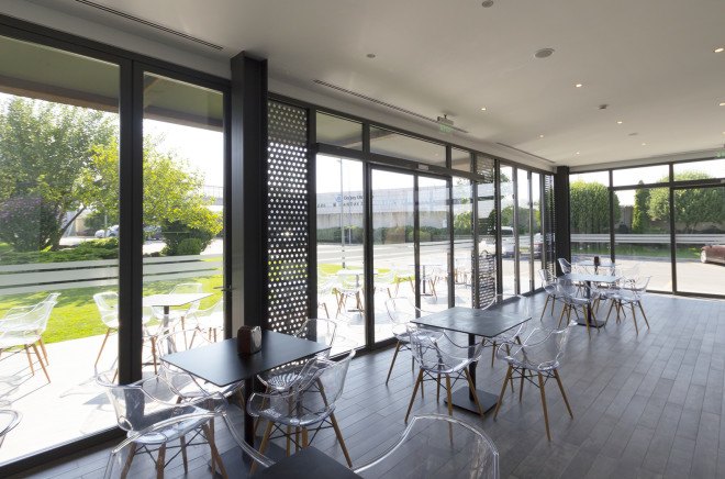 D Cafe, Dogus Automotive AS, Turkey, green interiors, recycled metal, metal facade, perforated facade, green architecture, natural lighting, floor-to-ceiling window