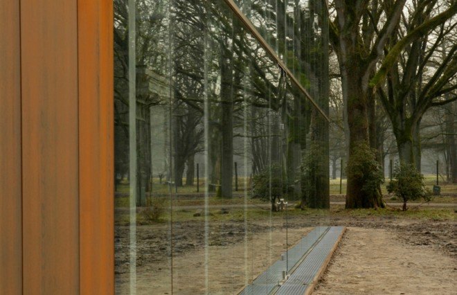 Oving Architecten, Holocaust Memorial, Kamp Westerbork, glass-enclosed home, urban memorials, holocaust memorials netherlands, dutch concentration camps, SS commander Albert Konrad Gemmeker, Anne Frank, modern holocaust sites,