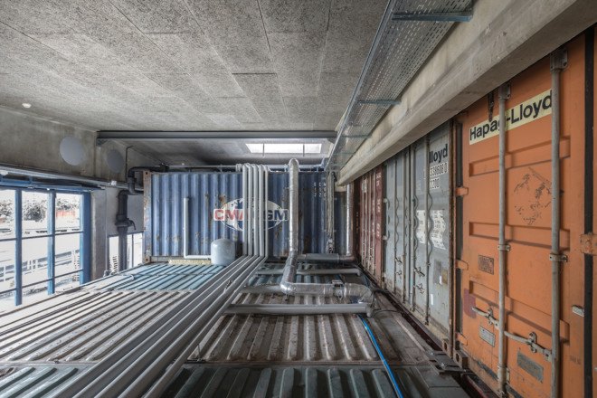 Savioz Fabrizzi Architects, Le Port Franc, Le Port Franc by Savioz Fabrizzi Architects, music venue, shipping containers, shipping container architecture, cargotecture, Sion, Le Port Franc sion, concert hall, shipping container music hall, shipping container bar,