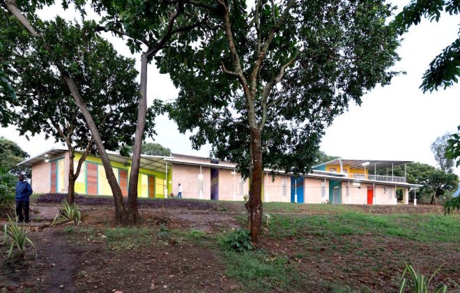 Kigutu, Burundi, corrugated metal, Louise Braverman, Village Health Works Staff Housing, Village Health Works, Village Health Works by Louise Braverman, solar array, solar power, off grid, off grid housing, rainwater collection, solar water heaters, local materials,