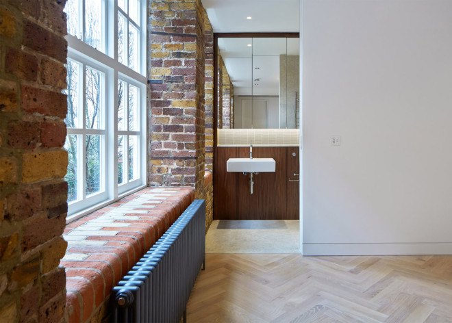 warehouse renovation, London, green renovation, skylights, Emrys Architects, slanted roofs, natural light, brickwork, brick building, historical building, listed building
