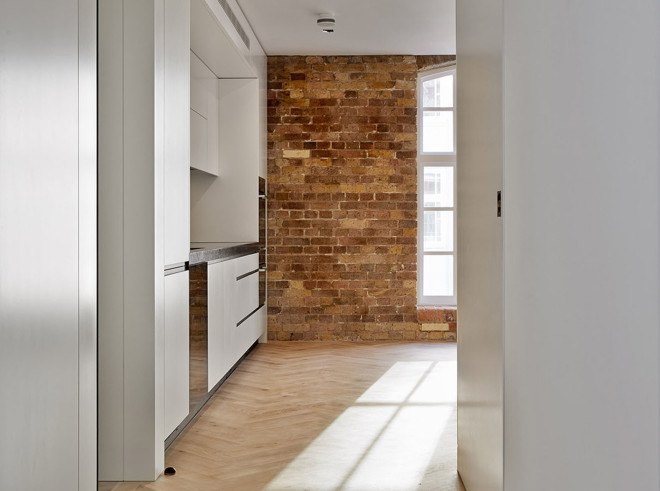 warehouse renovation, London, green renovation, skylights, Emrys Architects, slanted roofs, natural light, brickwork, brick building, historical building, listed building