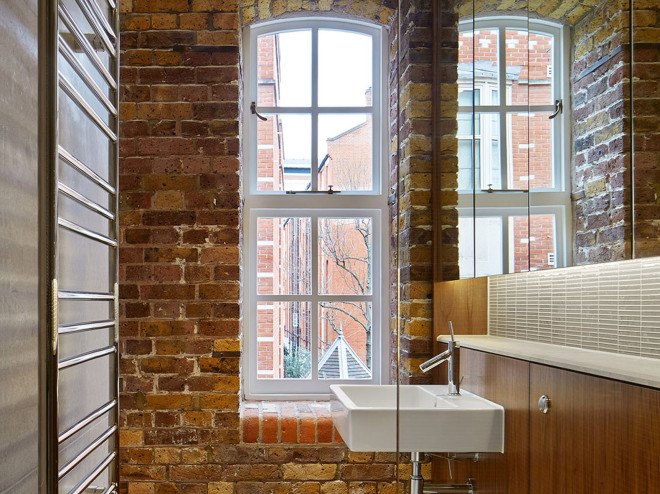 warehouse renovation, London, green renovation, skylights, Emrys Architects, slanted roofs, natural light, brickwork, brick building, historical building, listed building