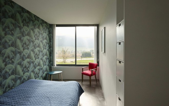green roof, Casa Jura, Casa Jura by JDS Architects, JDS Architects, green roofed home, green roofed retreat, holiday home, holiday retreat, open plan layout, open plan, full height glazing, house built into a slope, walk on green roof, Jura mountains