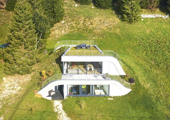 green roof, Casa Jura, Casa Jura by JDS Architects, JDS Architects, green roofed home, green roofed retreat, holiday home, holiday retreat, open plan layout, open plan, full height glazing, house built into a slope, walk on green roof, Jura mountains