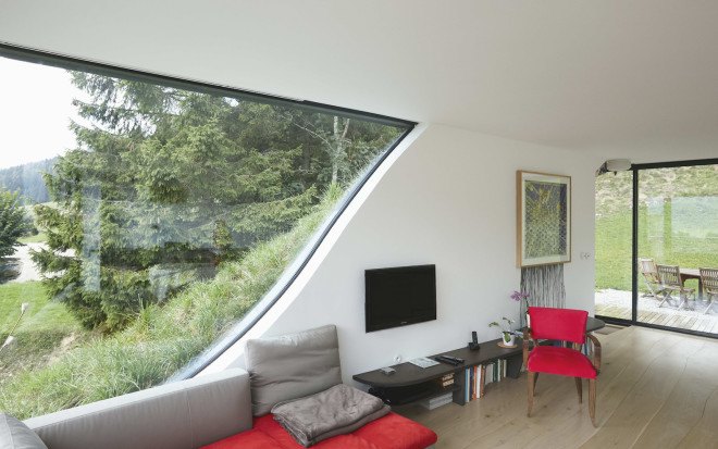 green roof, Casa Jura, Casa Jura by JDS Architects, JDS Architects, green roofed home, green roofed retreat, holiday home, holiday retreat, open plan layout, open plan, full height glazing, house built into a slope, walk on green roof, Jura mountains