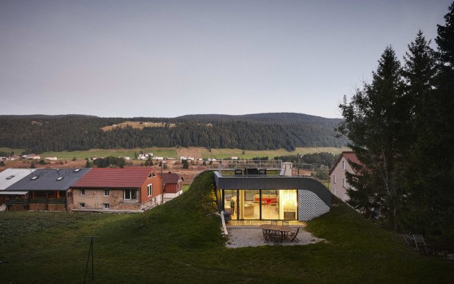 green roof, Casa Jura, Casa Jura by JDS Architects, JDS Architects, green roofed home, green roofed retreat, holiday home, holiday retreat, open plan layout, open plan, full height glazing, house built into a slope, walk on green roof, Jura mountains