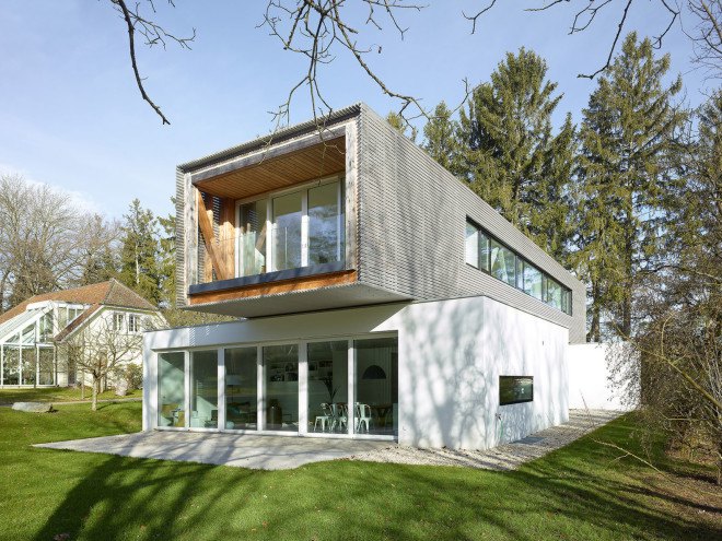 Tannay Bridge House, Christian von Düring, Switzerland, tiimber cladding, green architecture, family home, Geneva, open-plan layout, natural light, suburban house