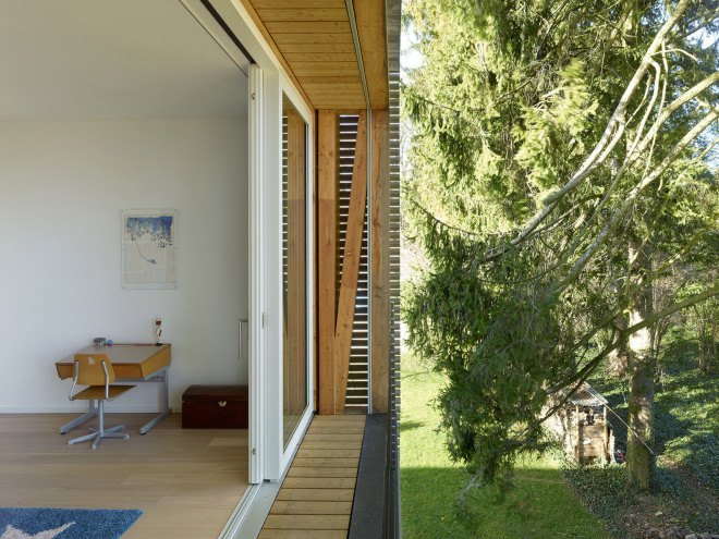 Tannay Bridge House, Christian von Düring, Switzerland, tiimber cladding, green architecture, family home, Geneva, open-plan layout, natural light, suburban house