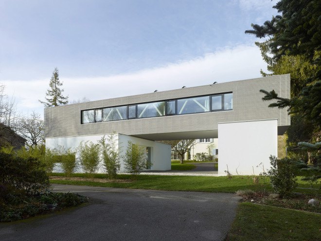 Tannay Bridge House, Christian von Düring, Switzerland, tiimber cladding, green architecture, family home, Geneva, open-plan layout, natural light, suburban house