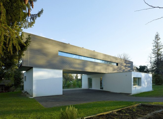 Tannay Bridge House, Christian von Düring, Switzerland, tiimber cladding, green architecture, family home, Geneva, open-plan layout, natural light, suburban house