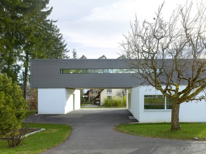 Tannay Bridge House, Christian von Düring, Switzerland, tiimber cladding, green architecture, family home, Geneva, open-plan layout, natural light, suburban house