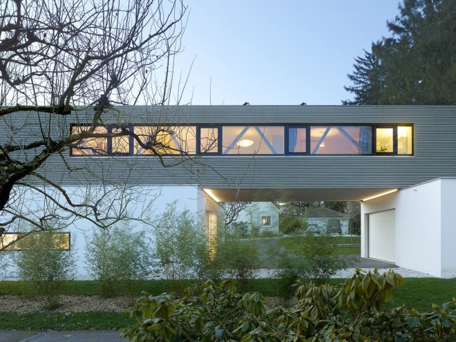 Tannay Bridge House, Christian von Düring, Switzerland, tiimber cladding, green architecture, family home, Geneva, open-plan layout, natural light, suburban house