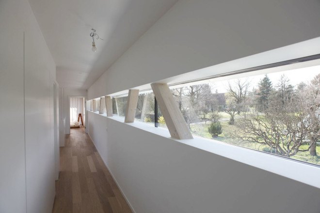 Tannay Bridge House, Christian von Düring, Switzerland, tiimber cladding, green architecture, family home, Geneva, open-plan layout, natural light, suburban house