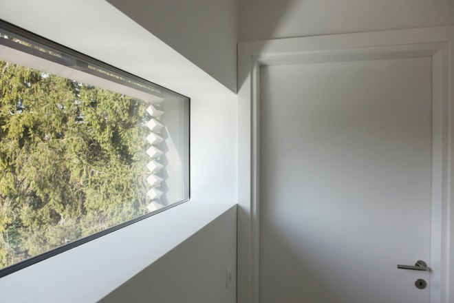 Tannay Bridge House, Christian von Düring, Switzerland, tiimber cladding, green architecture, family home, Geneva, open-plan layout, natural light, suburban house