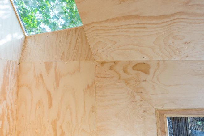 Architensions, Writing Pavilion, writer’s studio, Writing Pavilion by Architensions, Brooklyn, Brooklyn writer’s studio, art studio, plywood, black stained cedar, natural light, skylight, glazed door,