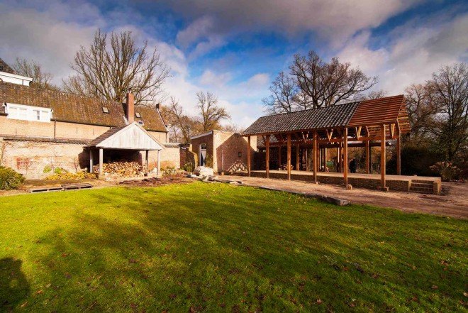 DeBossa, timber pavilion, indoor/outdoor space, split-level shelter, Dutch Mansion, The Netherlands, Eindhoven, Brabants Landschap, firewood storage, gable roof pavilion,