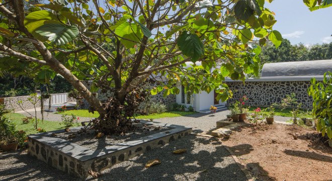 The Walls and Vaults House, India architecture, LIJO.RENY.architects, passive cooling, passive house, stone walls, granite, green architecture, multi-generational home, tropical plants