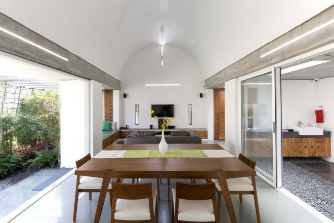 The Walls and Vaults House, India architecture, LIJO.RENY.architects, passive cooling, passive house, stone walls, granite, green architecture, multi-generational home, tropical plants