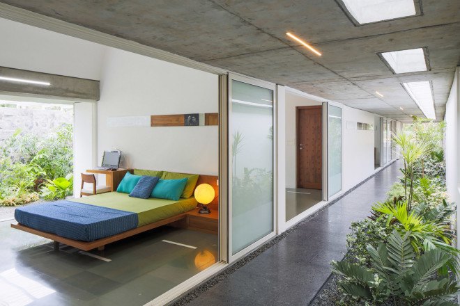 The Walls and Vaults House, India architecture, LIJO.RENY.architects, passive cooling, passive house, stone walls, granite, green architecture, multi-generational home, tropical plants