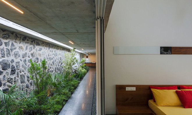 The Walls and Vaults House, India architecture, LIJO.RENY.architects, passive cooling, passive house, stone walls, granite, green architecture, multi-generational home, tropical plants
