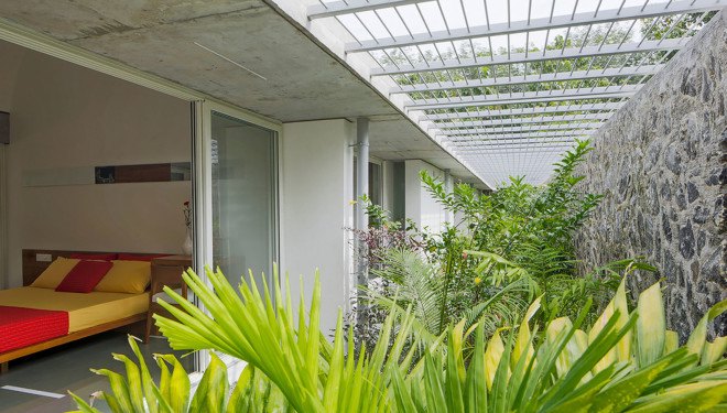 The Walls and Vaults House, India architecture, LIJO.RENY.architects, passive cooling, passive house, stone walls, granite, green architecture, multi-generational home, tropical plants