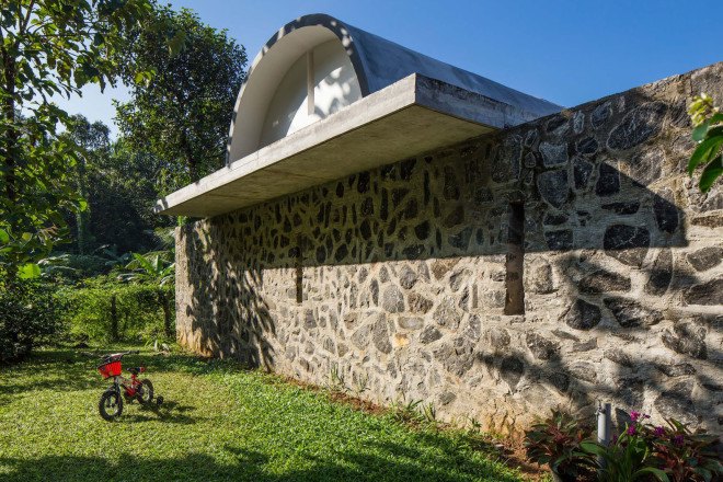 The Walls and Vaults House, India architecture, LIJO.RENY.architects, passive cooling, passive house, stone walls, granite, green architecture, multi-generational home, tropical plants