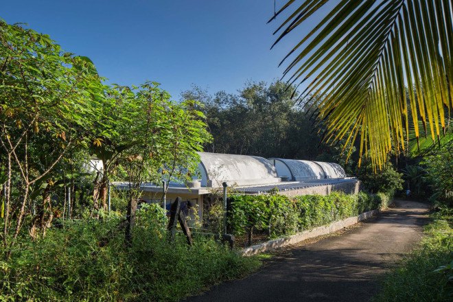 The Walls and Vaults House, India architecture, LIJO.RENY.architects, passive cooling, passive house, stone walls, granite, green architecture, multi-generational home, tropical plants