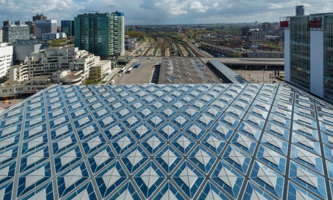 Benthem Crouwel Architects, Den Haag Centraal station, Hague railway roof, diamond shaped roof, glass roof, architecture, amsterdam train station, train station design, architecture, green design, sustainable design,