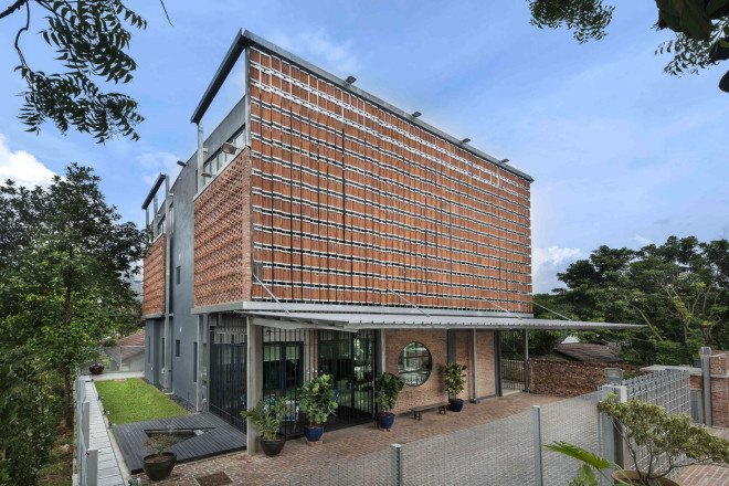 Clay Roof House, DRTAN LM Architect, perforated brick, perforated facade, reused materials, terracotta, clay roof tiles, green renovation, green architecture, natural ventilation, shading system, natural building materials