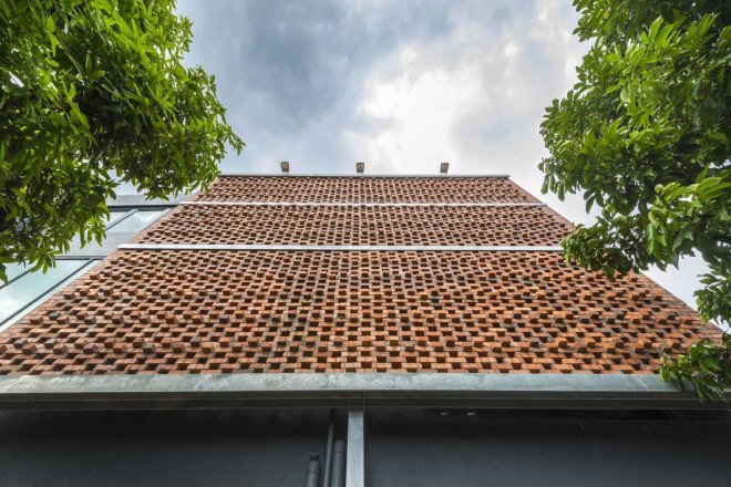 Clay Roof House, DRTAN LM Architect, perforated brick, perforated facade, reused materials, terracotta, clay roof tiles, green renovation, green architecture, natural ventilation, shading system, natural building materials