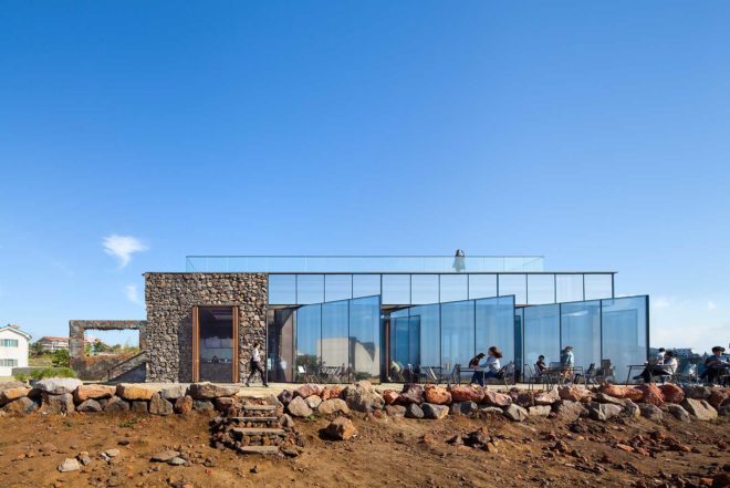 platform_a, glazed cafe, platform_monsant, Aeweol, South Korea, crushed stone, unfinished concrete wall, reflective glass skin,