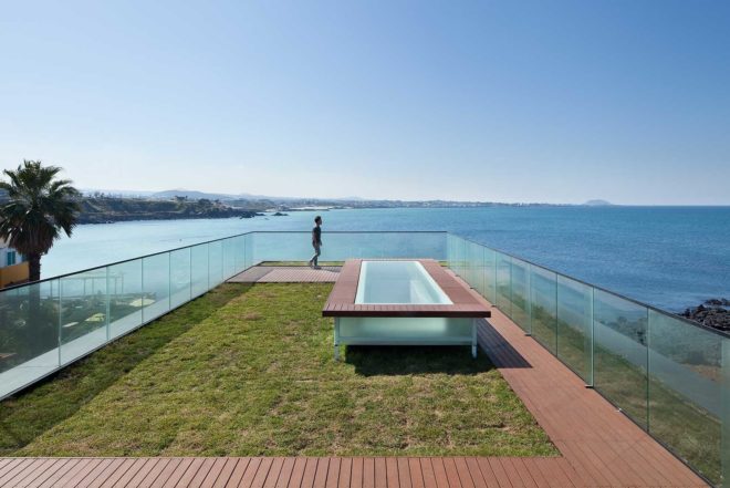 platform_a, glazed cafe, platform_monsant, Aeweol, South Korea, crushed stone, unfinished concrete wall, reflective glass skin,