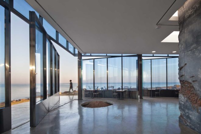 platform_a, glazed cafe, platform_monsant, Aeweol, South Korea, crushed stone, unfinished concrete wall, reflective glass skin,