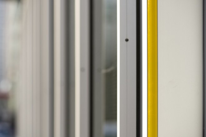 Canary Wharf Group solar project, solar bus shelter UK, solar bus shelter by Polysolar, solar bus shelter by Canary Wharf Group, transparent photovoltaics, transparent solar panels
