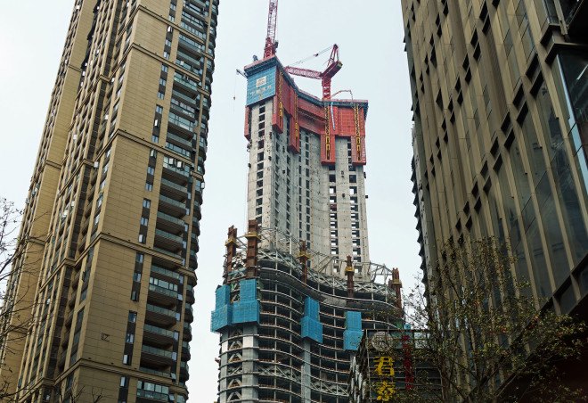 Wuhan Greenland Center, green tower, glass tower, China, world's tallest building, supertall buildings, Adrian Smith + Gordon Gill Architecture, glass facade glass tower, mixed use buildings, greywater reuse, energy-efficient lighting