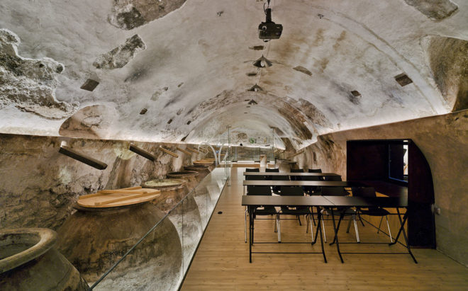 INMAT Arquitectura, wine cellar, green conversion, Spain, gallery space, wine cellar, glass walkways, glass ramp, green architecture, terracotta, landmark building