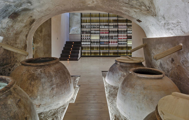 INMAT Arquitectura, wine cellar, green conversion, Spain, gallery space, wine cellar, glass walkways, glass ramp, green architecture, terracotta, landmark building