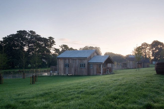 Michaelis Boyd, Soho House, Soho Farmhouse, England, countryside retreat, green retreat, London, private club, green architecture, infinity pool, communal spaces, mezzanine, sauna, kids playground, cabins