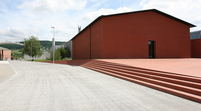 Herzog & de Meuron, Vitra Campus, Vitra Schaudepot, furniture design, design museum, furniture exhibition, 3d printed objects, temporary exhibition, green architecture, pitched roof, exhibition space