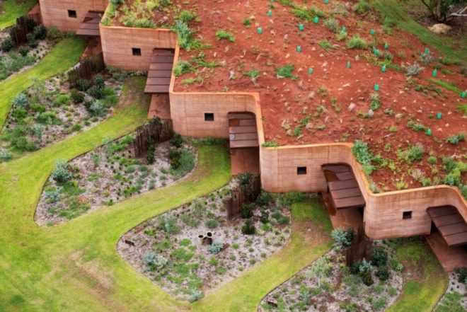 rammed earth building with green roof