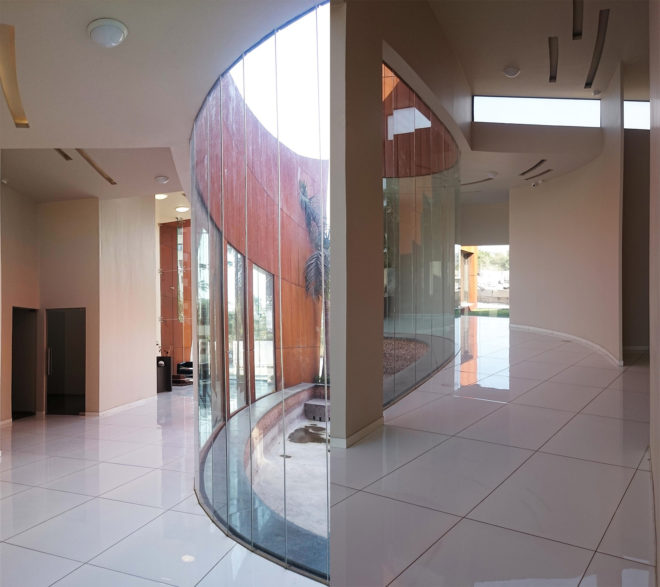 The Crescent by Sanjay Puri Architects, solar savvy architecture, curvaceous Corten Steel building, Corten Steel architecture, Corten steel office building, office design in India,